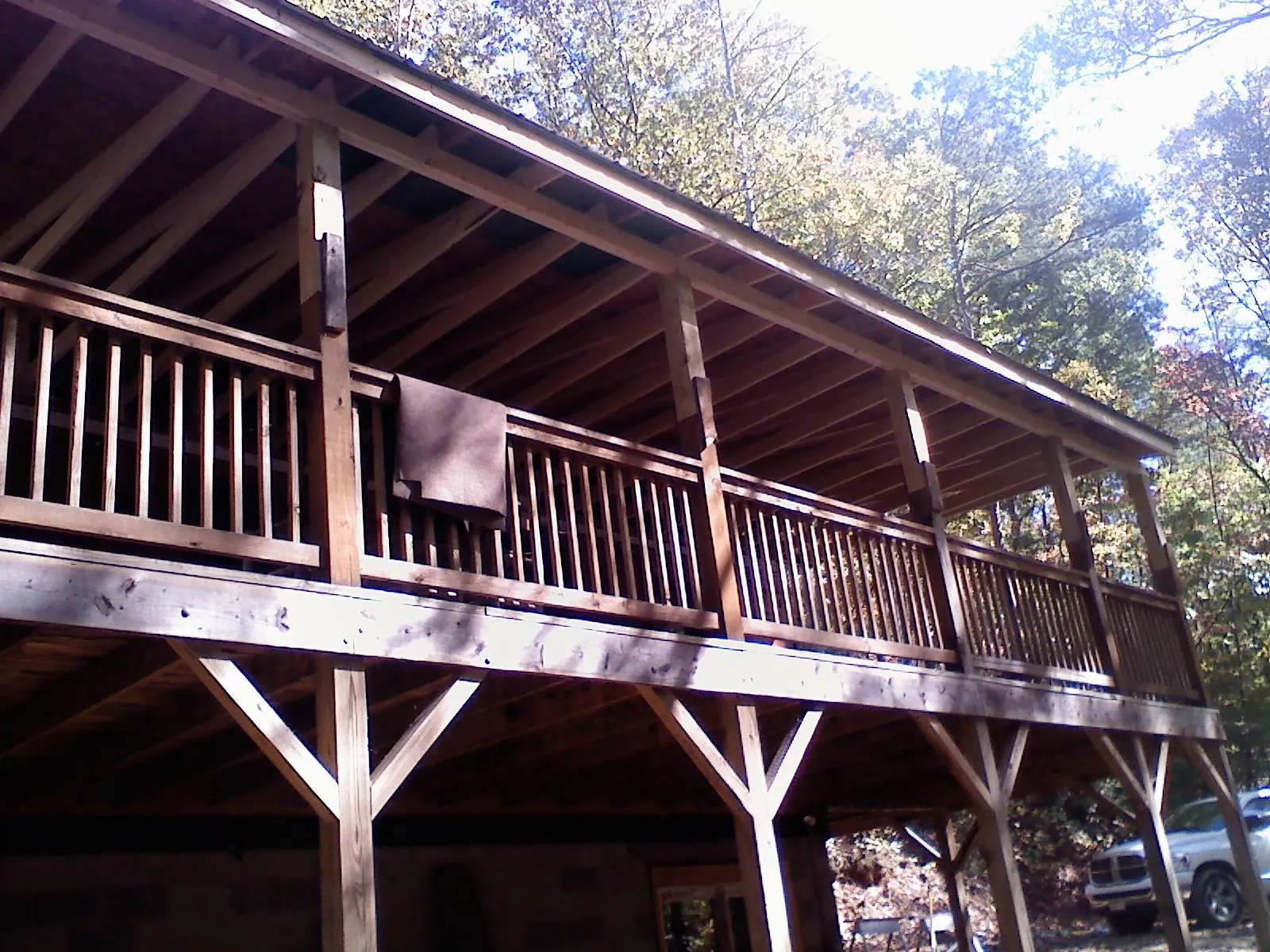 Timber framing under a new elevated porch and deck — Roof Leak Repair in Winchester by Roofing Brothers