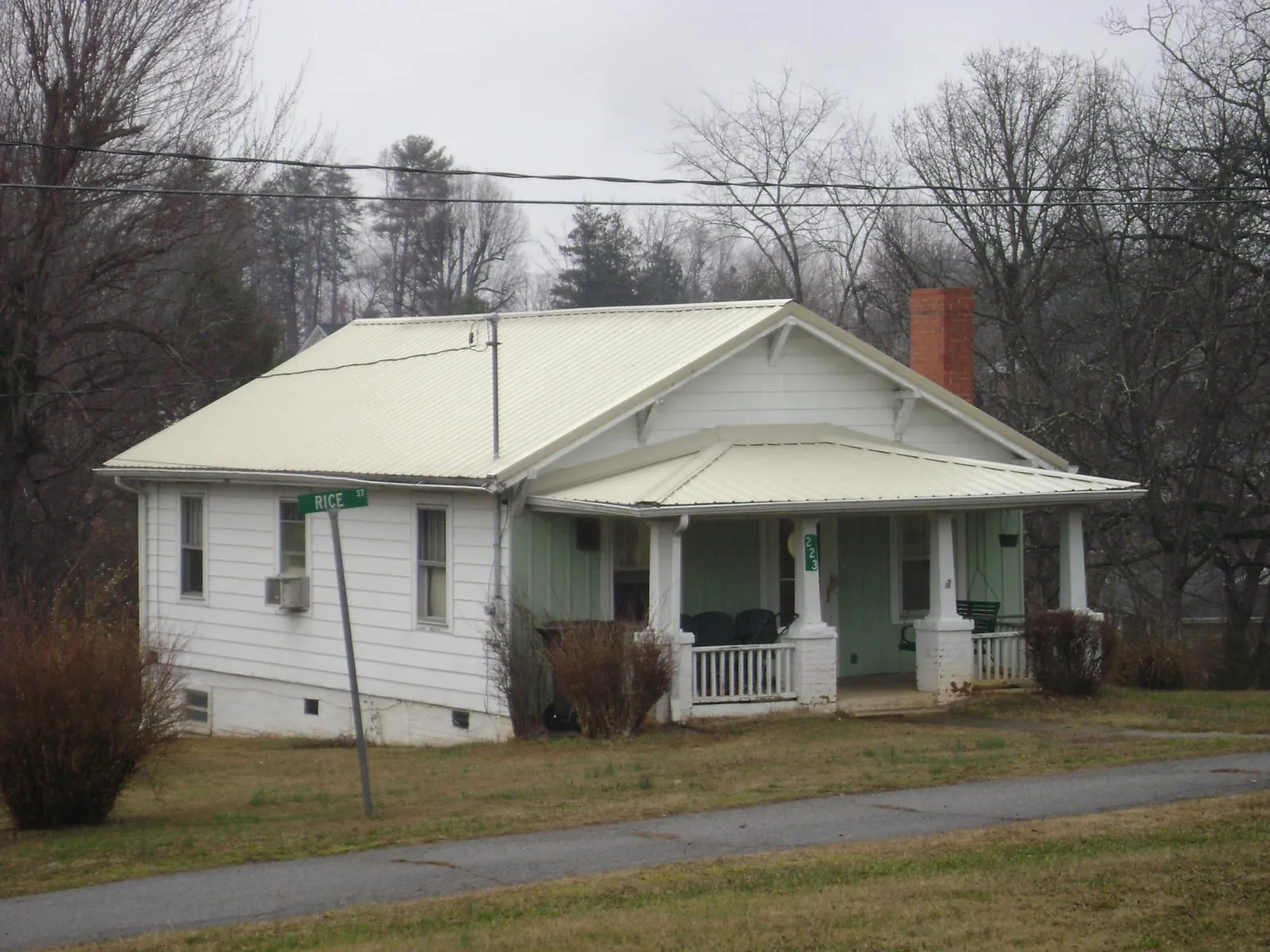 White metal roof on a craftsman bungalow at a street corner in Winchester